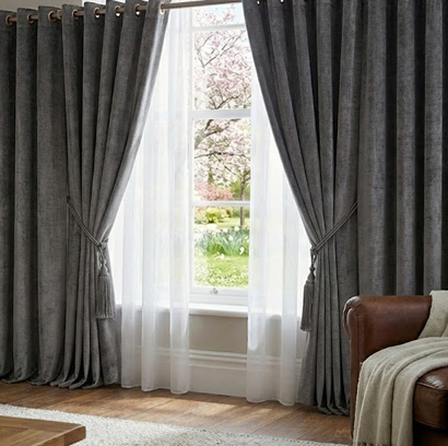 Hospitality curtain with layered drapes for hotel and guest room interiors